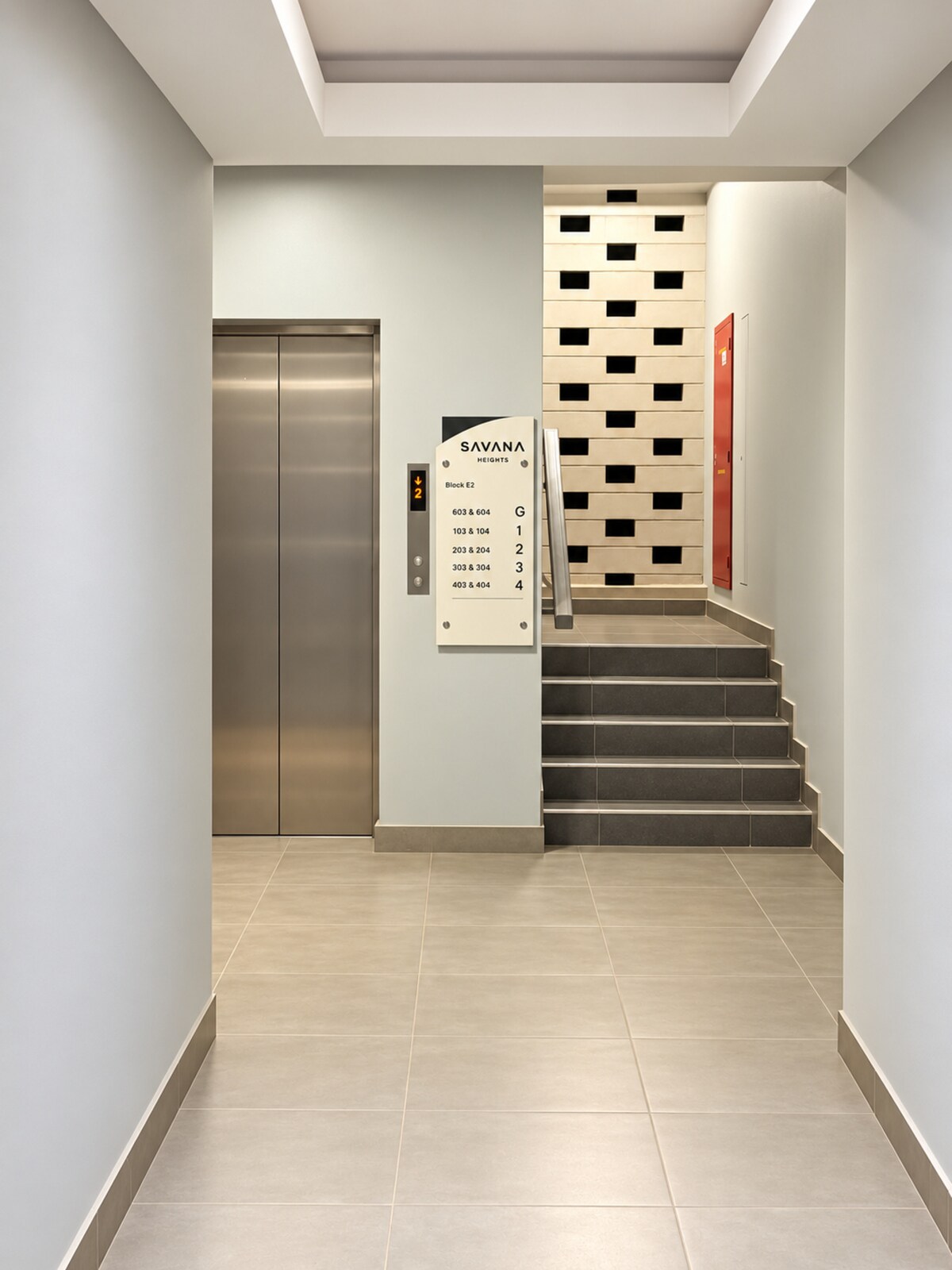 Clean apartment building entrance and lift lobby