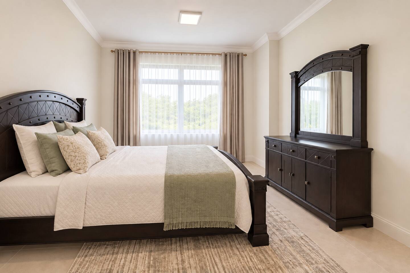 Main bedroom with queen bed and natural light